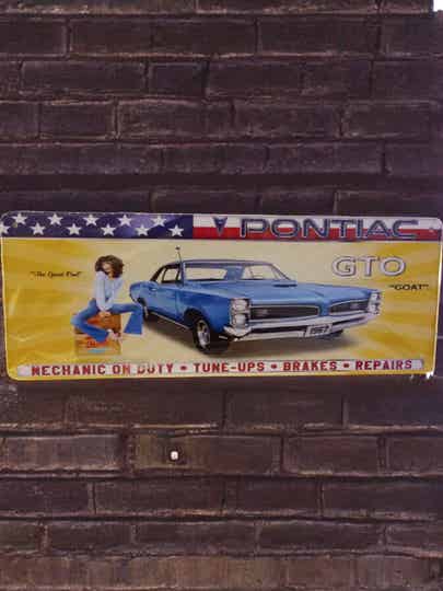 wandbord blauwe auto