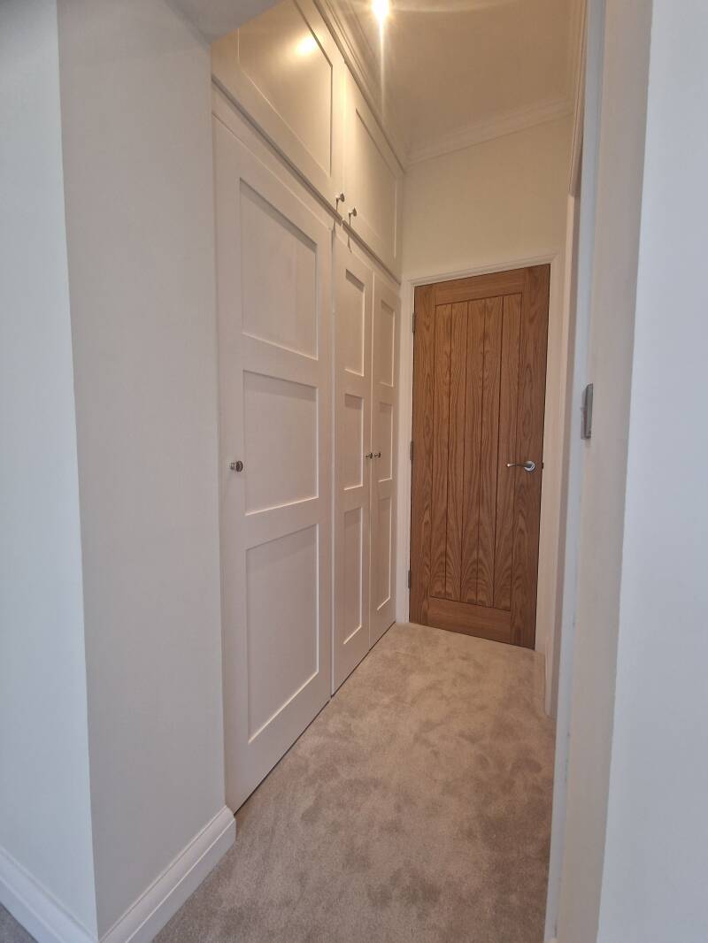 Oxted carpenter | White fitted cupboards and internal timber door | Oak & Stone Oxted carpenter – White fitted cupboards and internal timber door