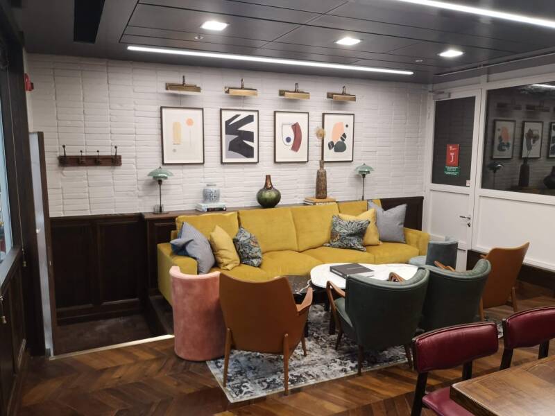 Completed commercial lounge fit-out in East Grinstead with timber floor and wall panelling