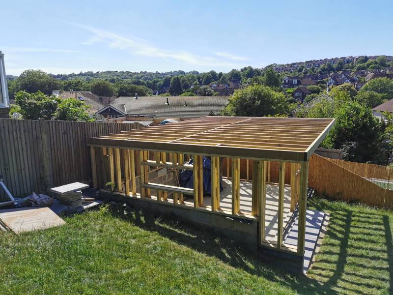 Timber frame during garden room construction in East Grinstead