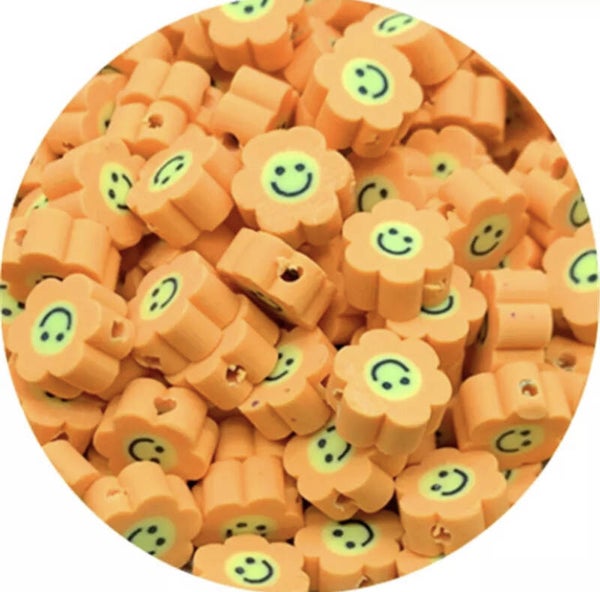 Polymeer bloem smiley kraal oranje - 1 stuk