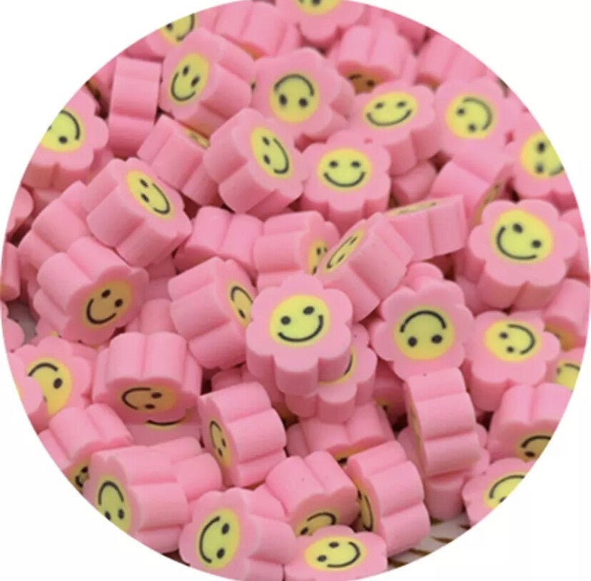 Polymeer bloem smiley kraal pastel roze - 1 stuk