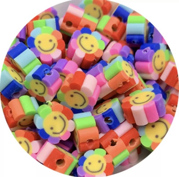 Polymeer bloem smiley kraal regenboog - 1 stuk