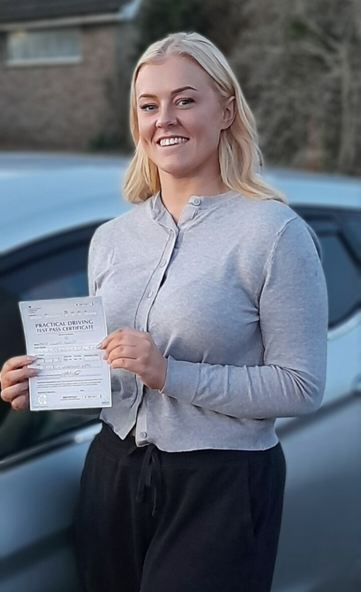 Photo of a happy student with a Driving Certificate from an easy passed exam day