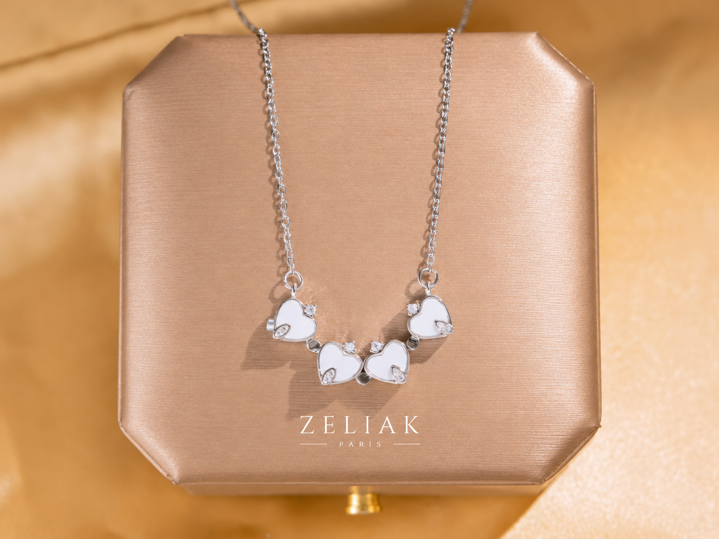 Collier argenté Quatre Cœurs