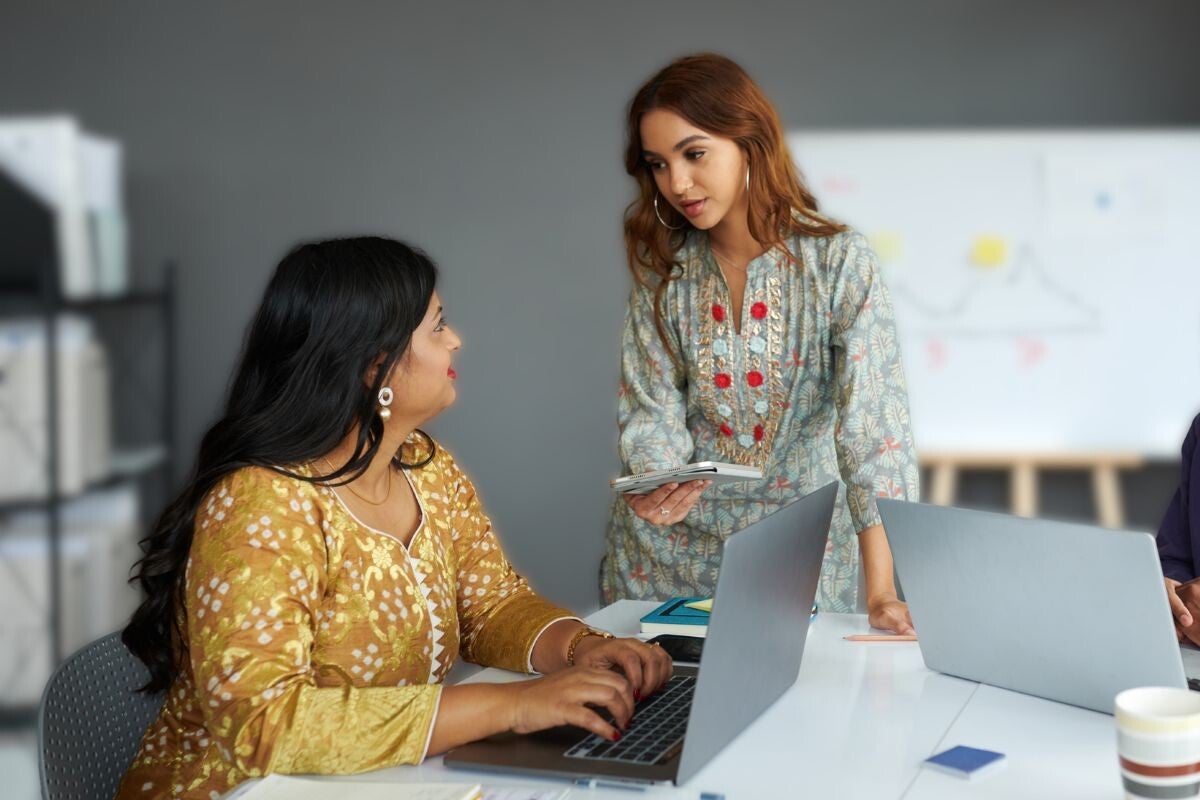 Two people discussing work