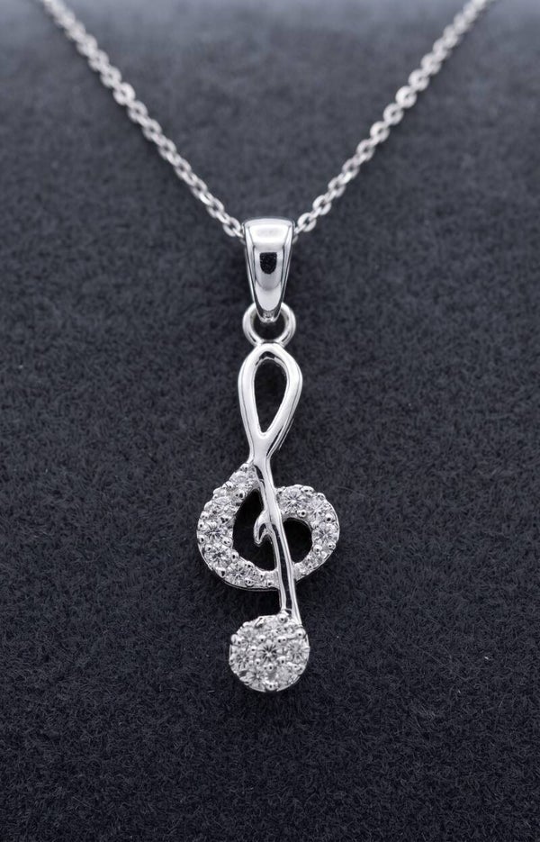 Dije "Clave de sol con brillantes" en plata 925
