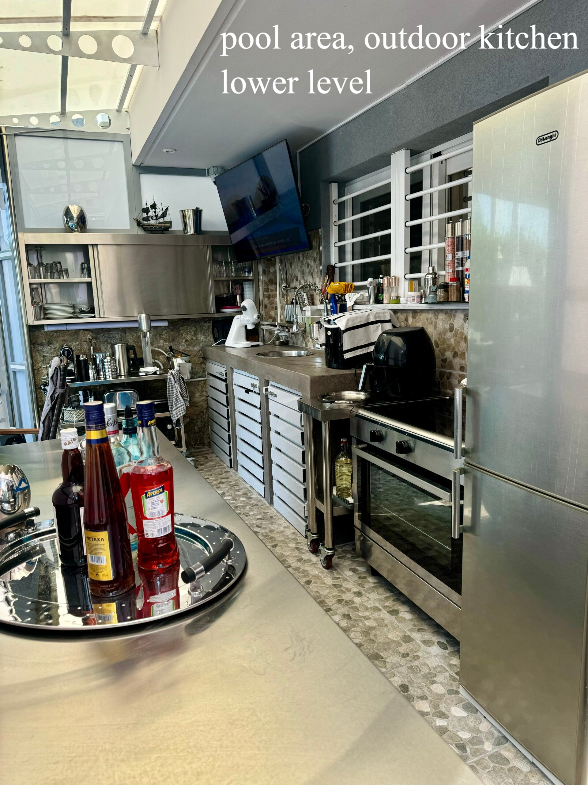 pool area, outdoor kitchen, lower level