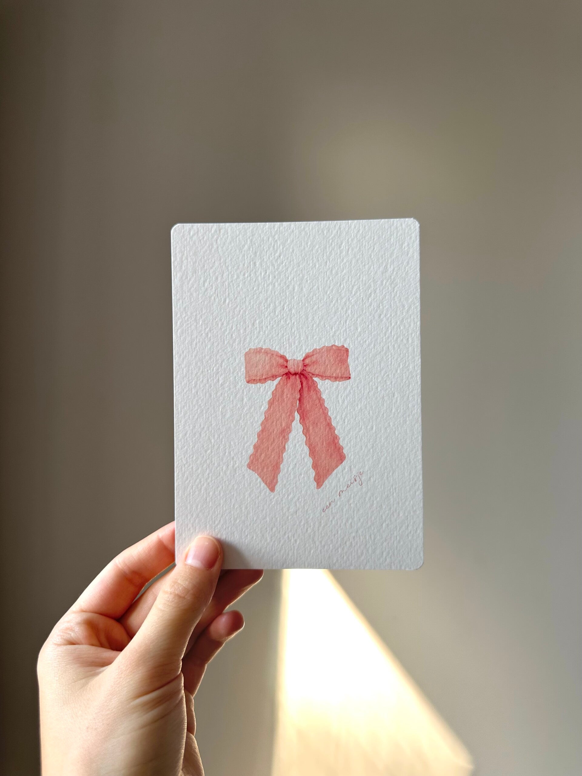 Kaart 'een meisje, roze strik'
