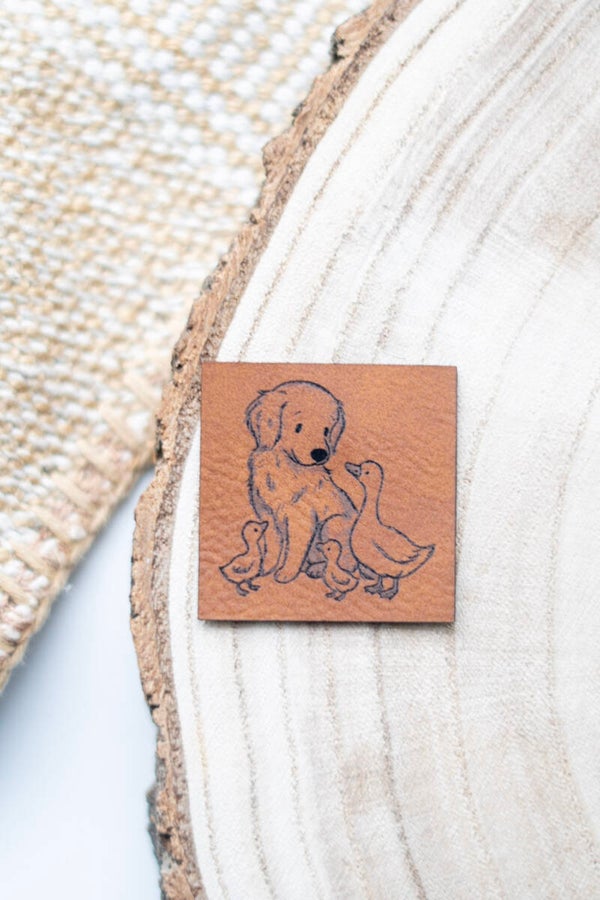 Hund mit Gänsen Label