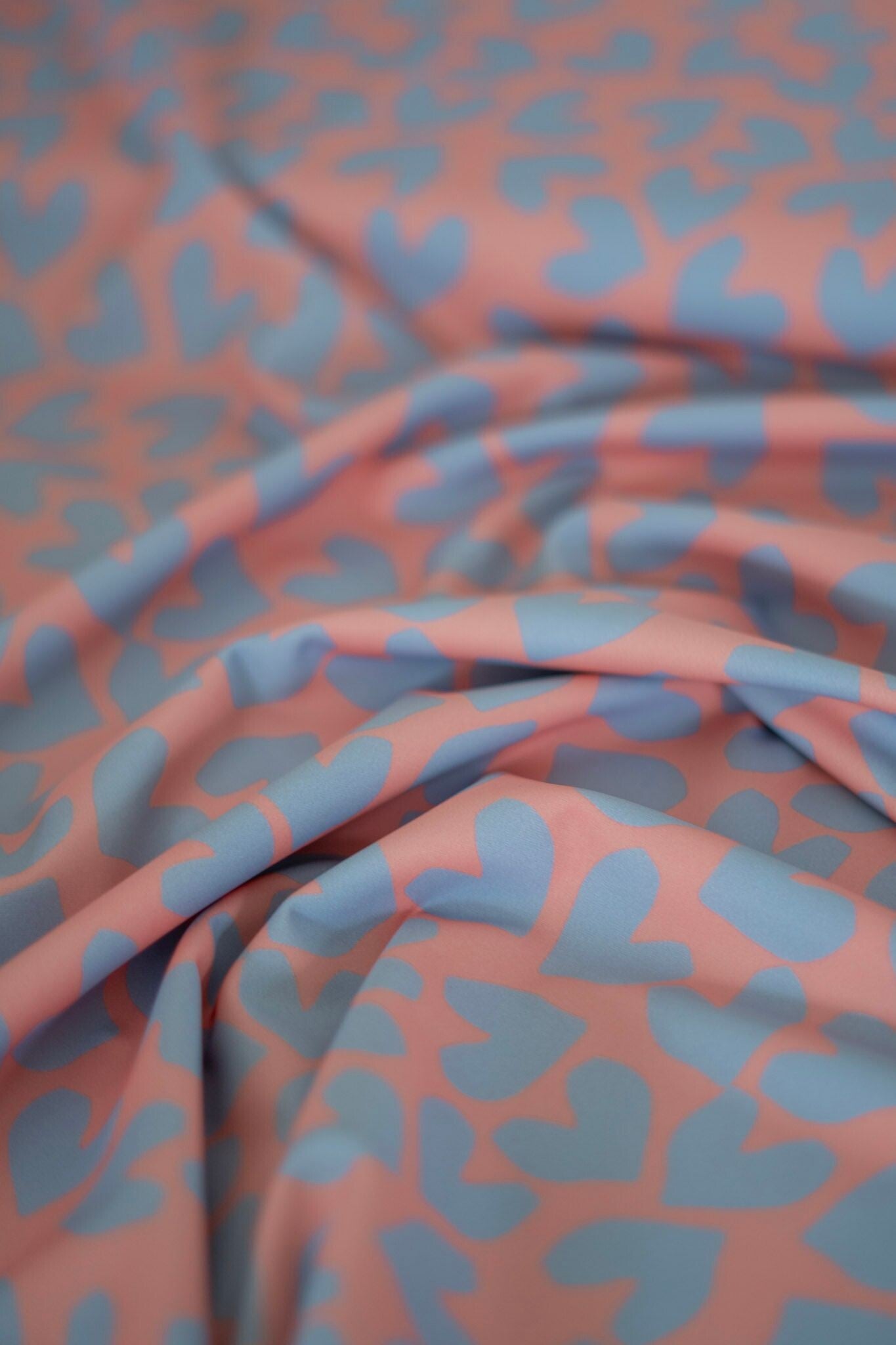 UV+ Stoff Orange Lila Herzen