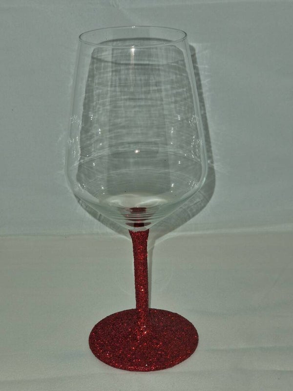 Wijnglas met rode glitters