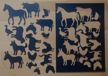 Figuren für das Schattentheater aus schwarzem Papier ausschneiden