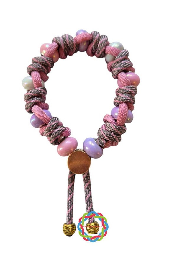 Paracord armband roze/lila met parelmoer kralen