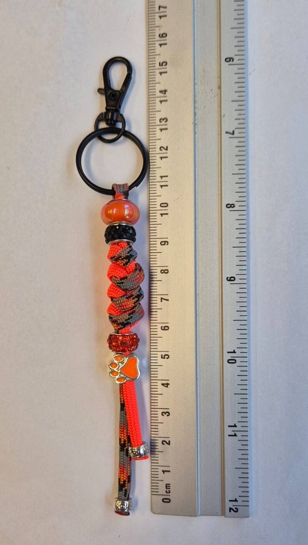 Sleutelhanger zwart, oranje combie 3 met pootje