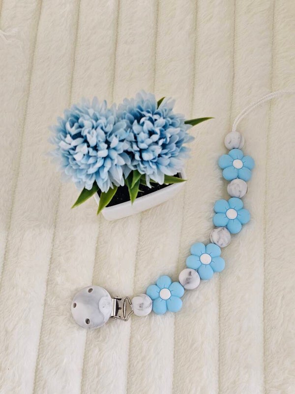 Attache tétine fleur bleu