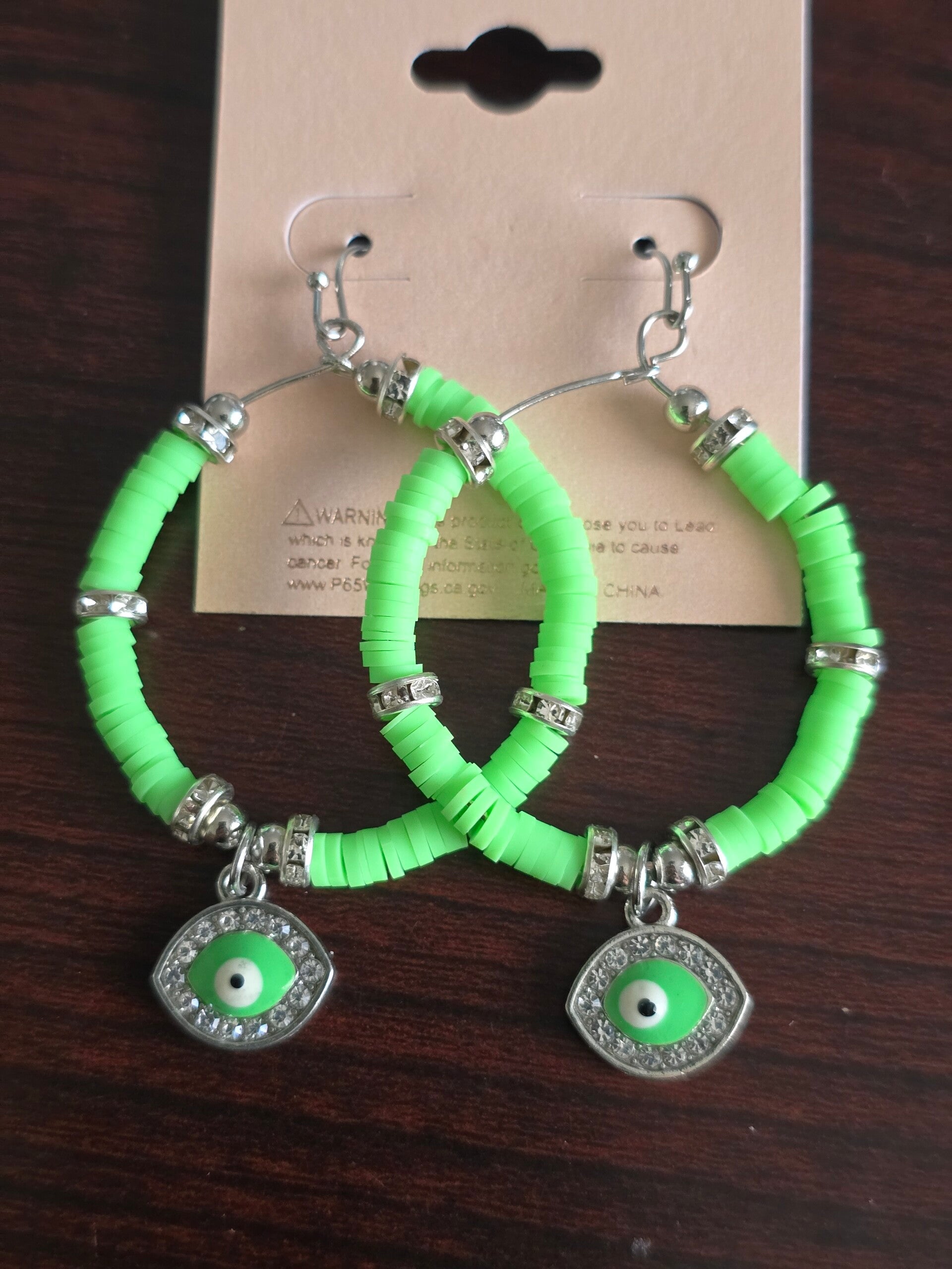 Green evil eye earrings