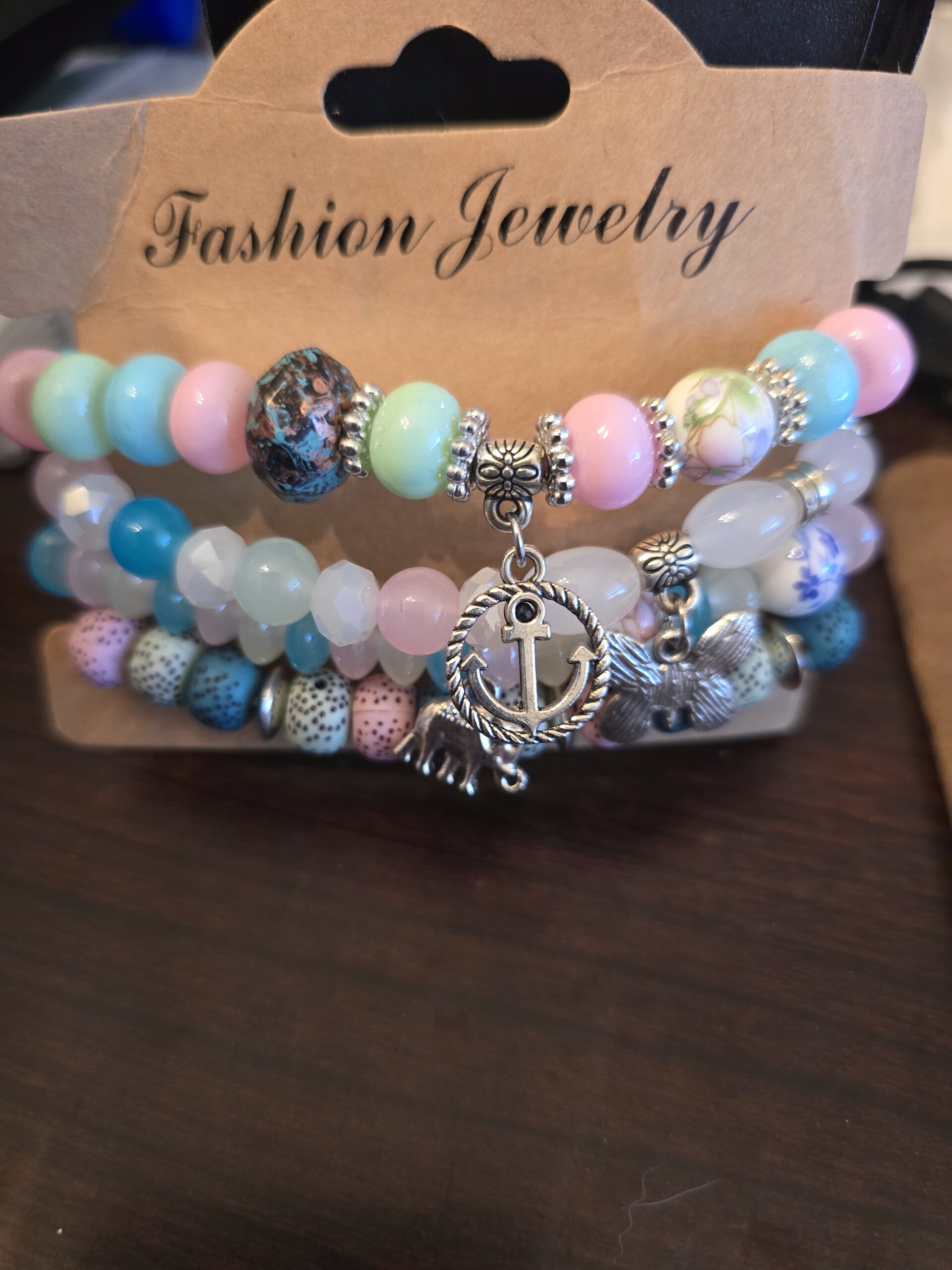 4 piece pastel bracelets with charm