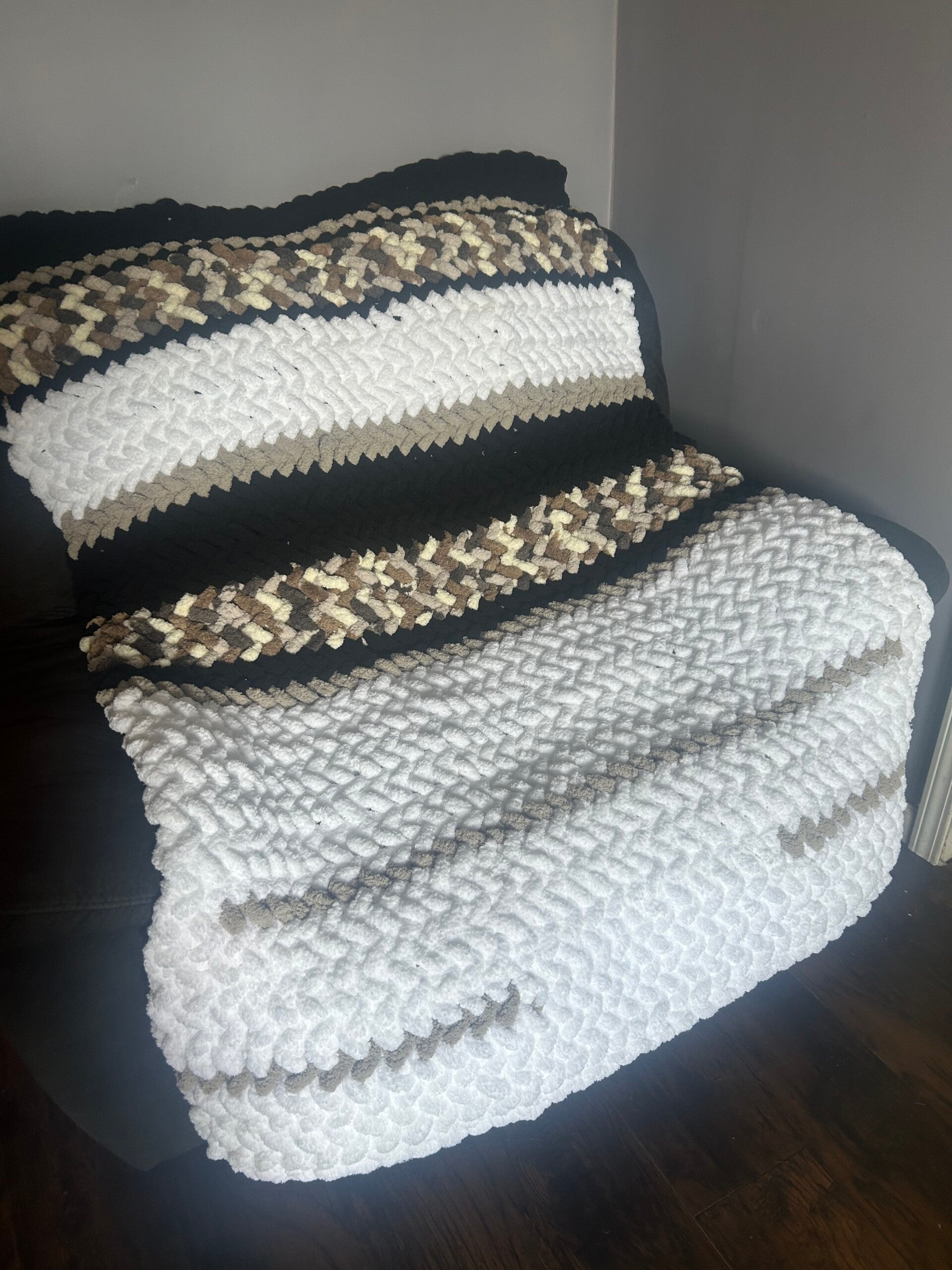White, gray, and black with pillow