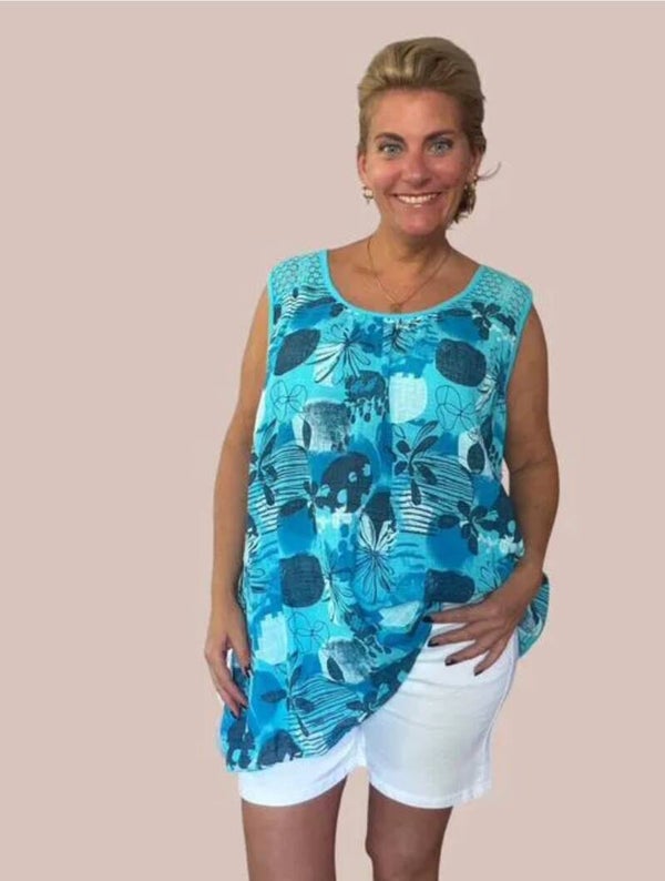 🌴 *Mouwloze print top met opengewerkte schouders*