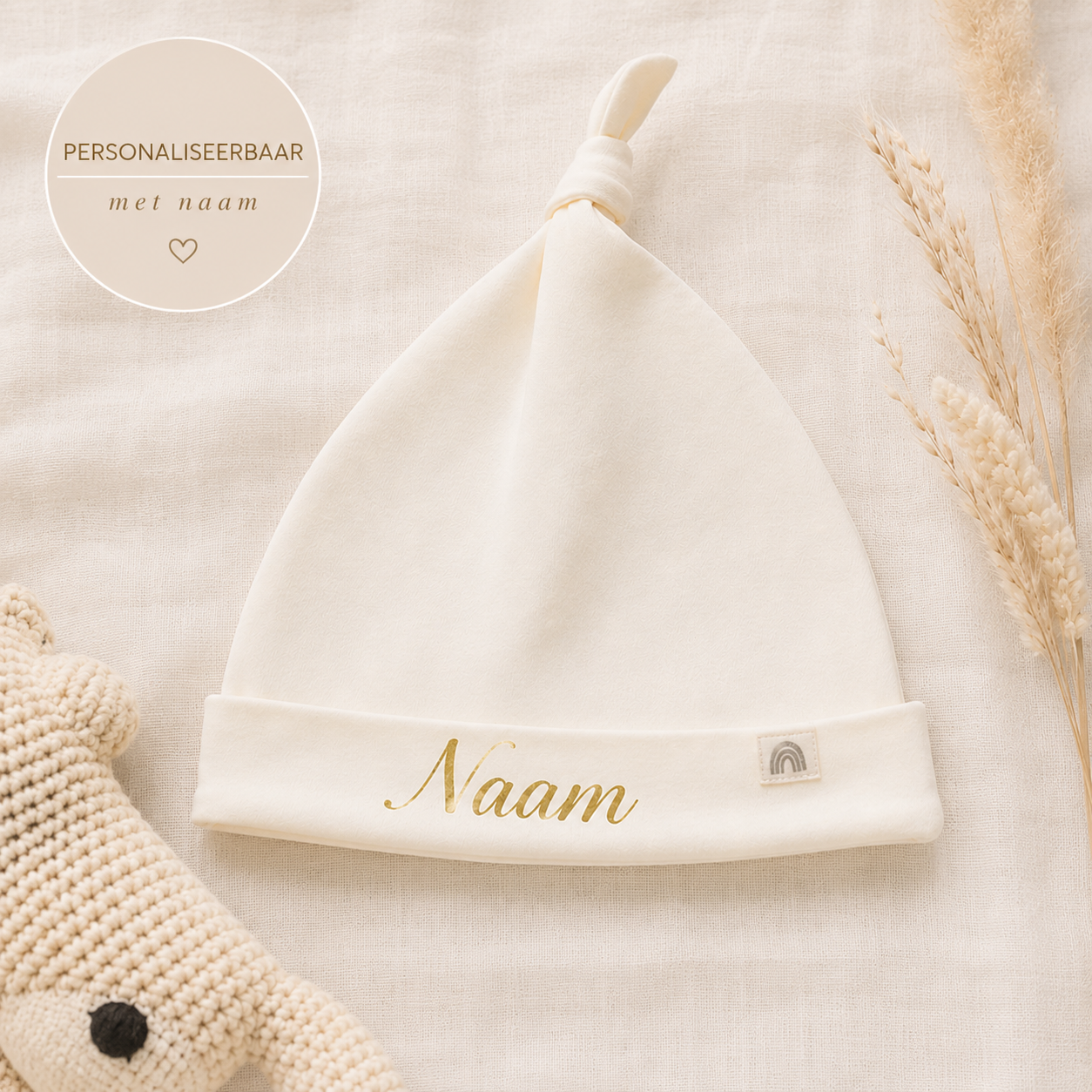 Babymuts met knoop en naam