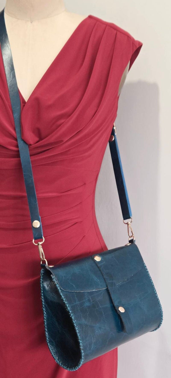 Oval Genuine Leather Handbag.