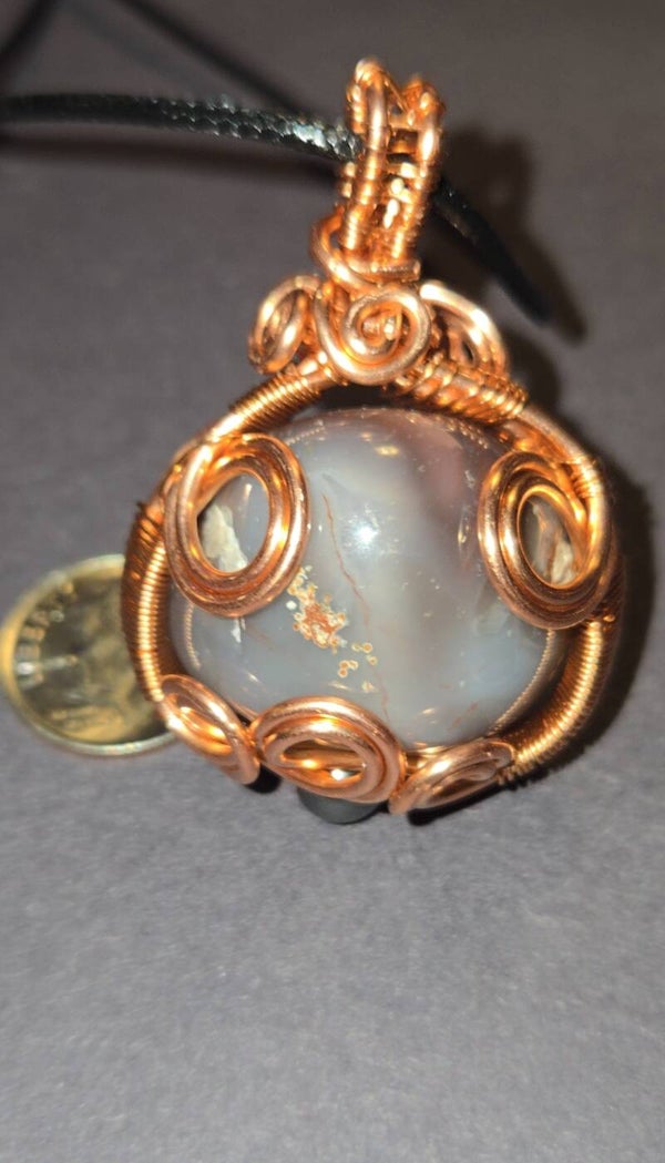 P9- Banded agate round, copper wire wrapped pendant.