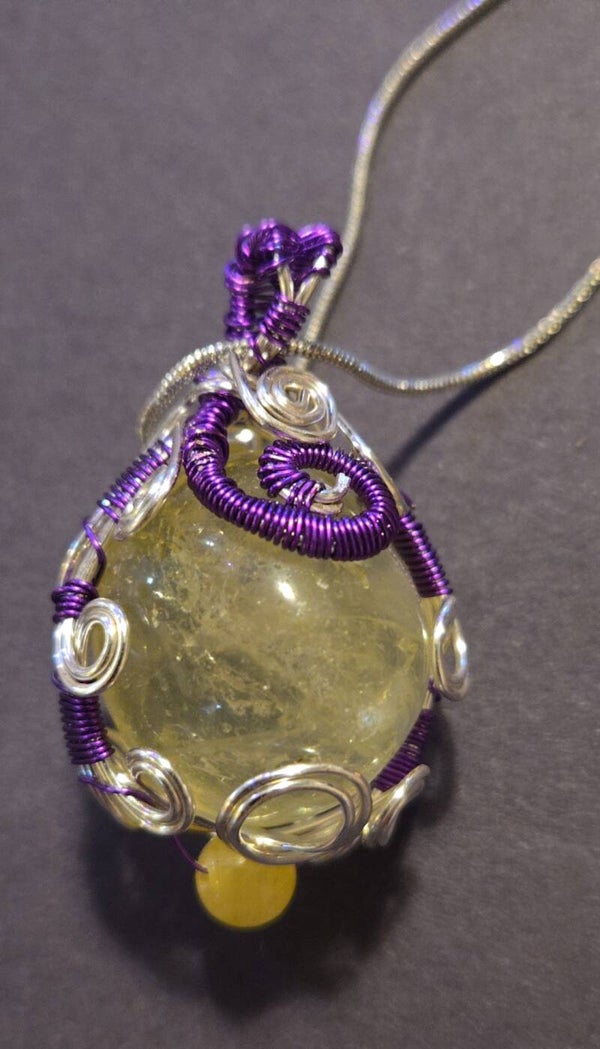 P8- Polished round light yellow quartz pendant. wire wrapped stainless and purple . STUNNING!! Great for mothers day!