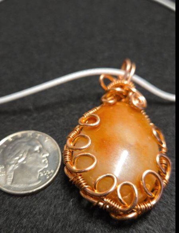 P2 - Polished red orange and white carnelian agate pendant. copper wrapped.