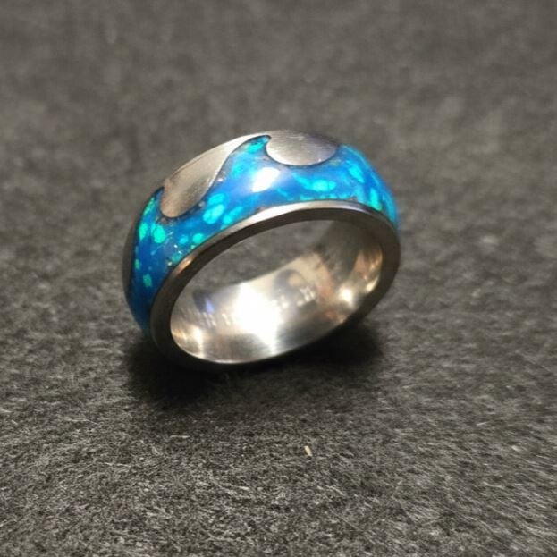 R19 . The wave. Size 5.5  Titanium wave. 7 opals, purple lapis and GLOW!!!!