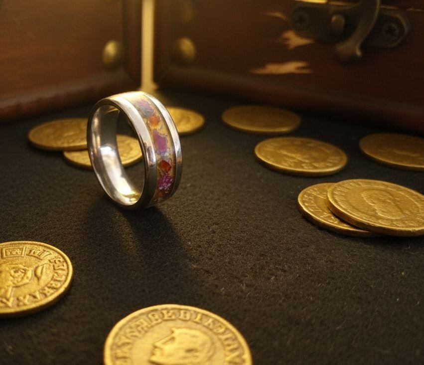 R-5 Size 8 Comfort fit inlay ring. Gold base with ruby flakes. U.V reactive.