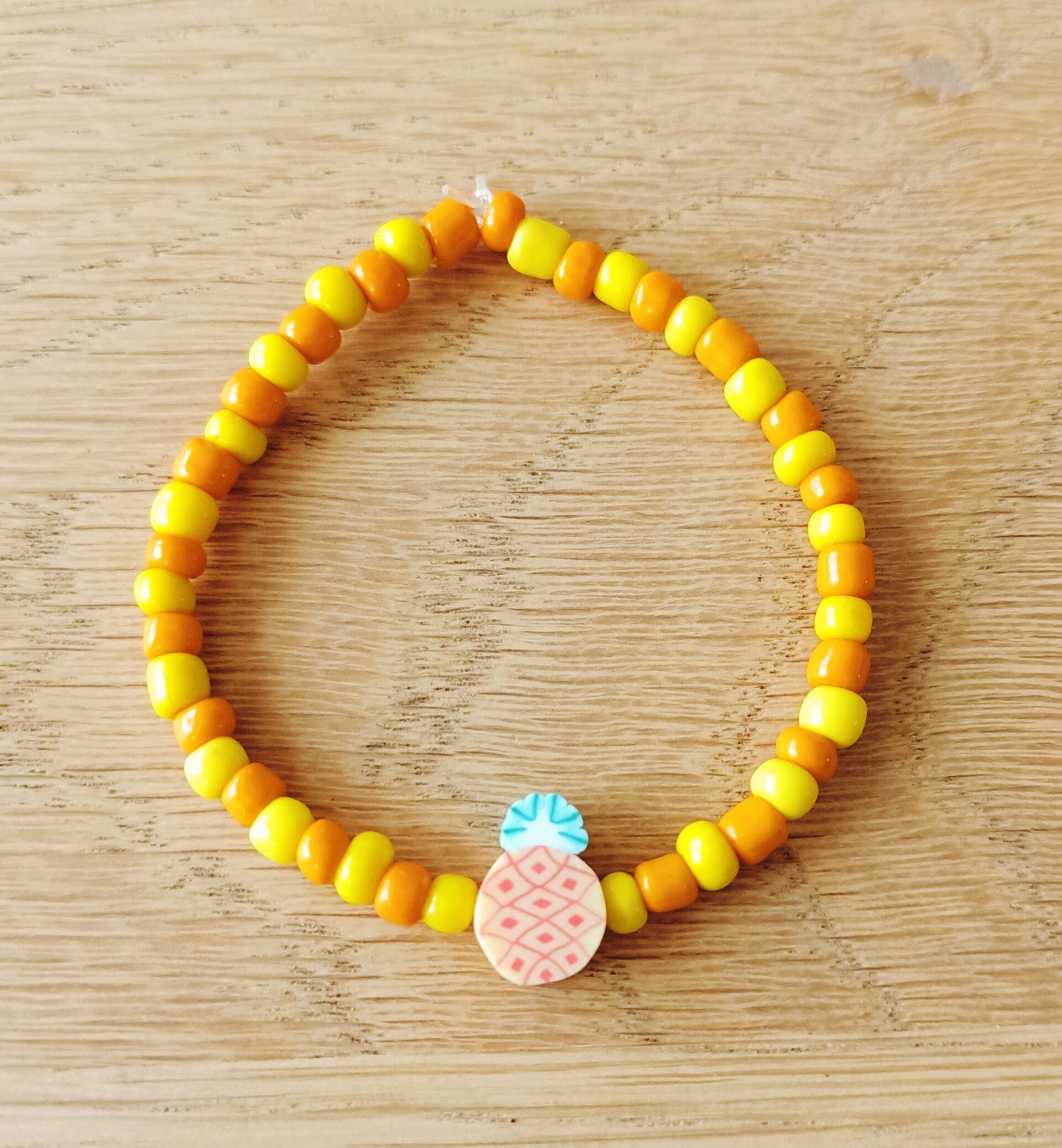 Kinderarmbandje, ananas geel/oranje