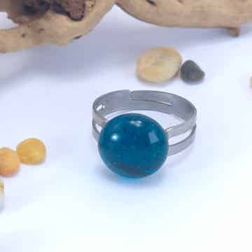 Verstelbare ring met glastop - transparant turquoise met een sparkle