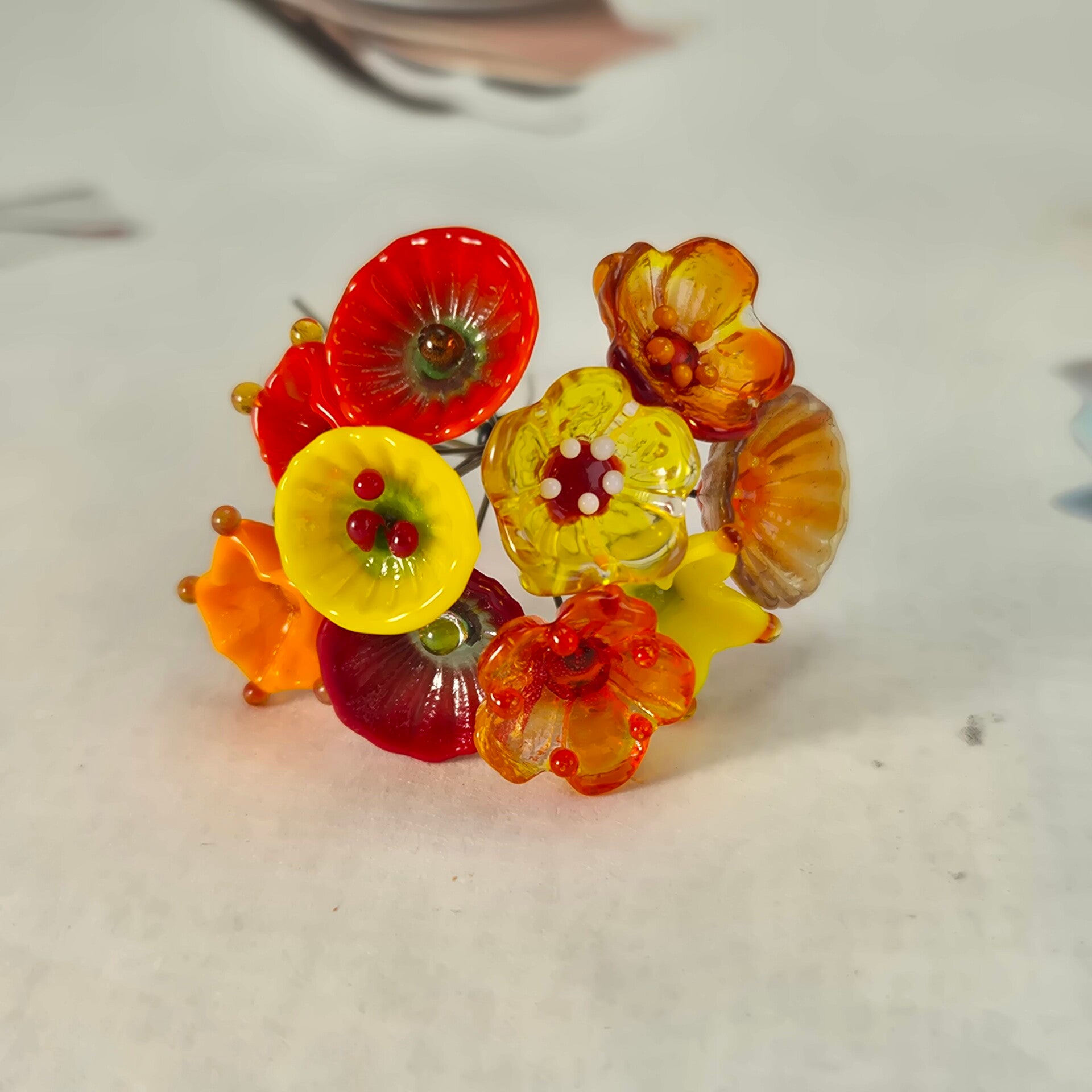 Tien glazen bloemetjes  - rood/oranje/geel