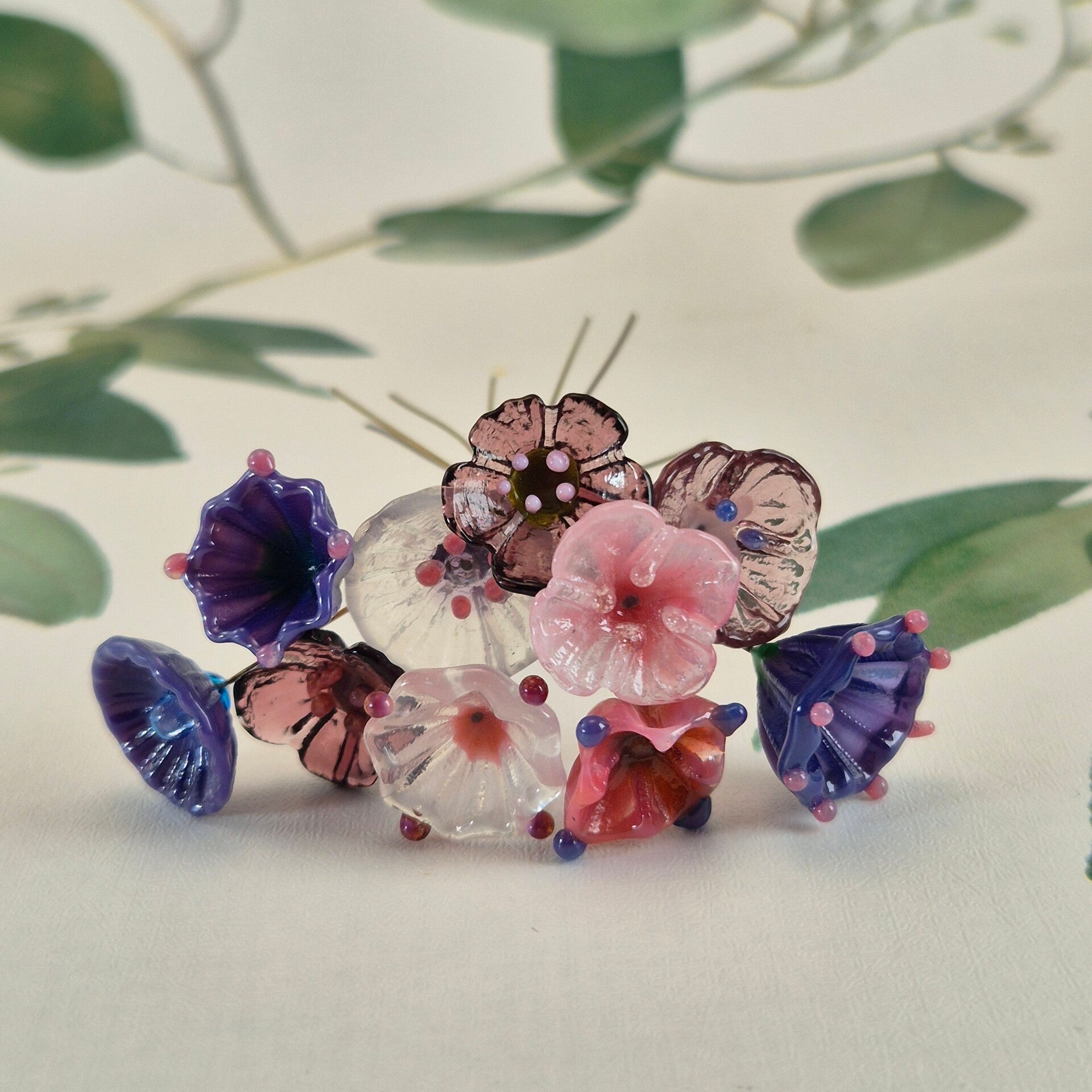 Tien glazen bloemetjes  - roze/paars