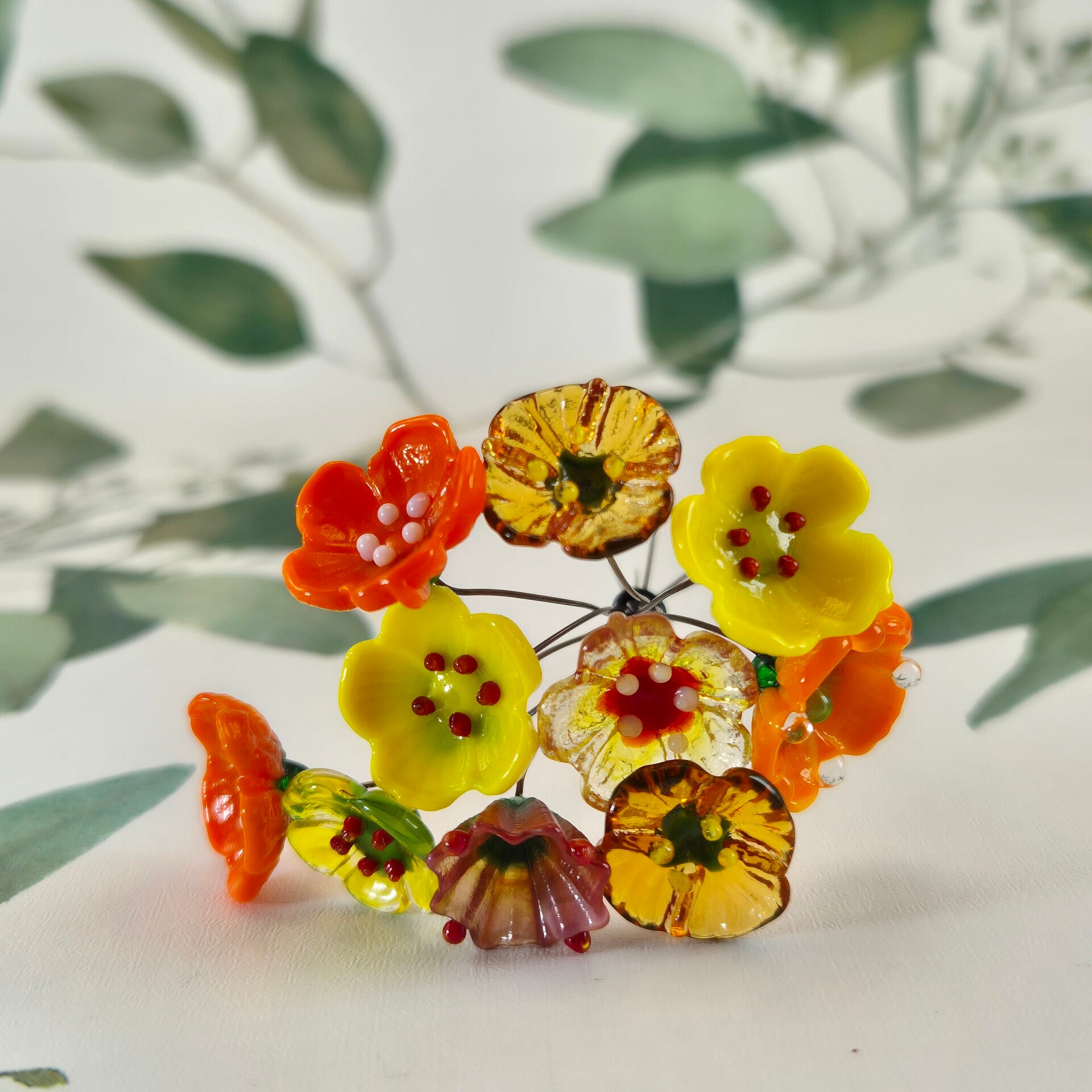 Tien glazen bloemetjes  - geel/oranje