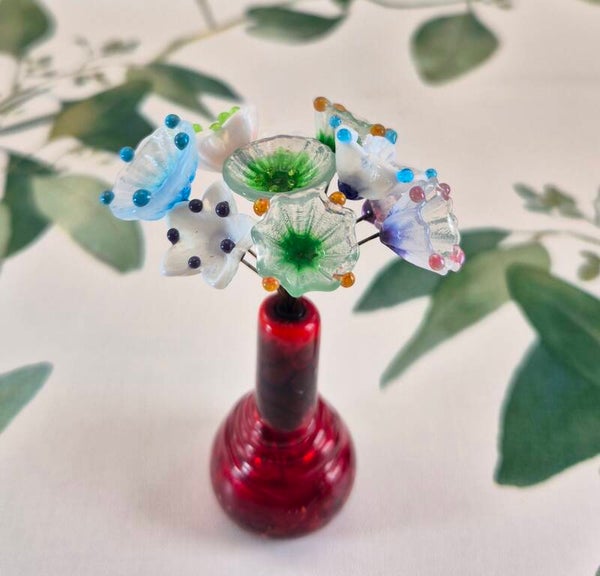 Tien glazen bloemetjes  - wit met diverse kleuren