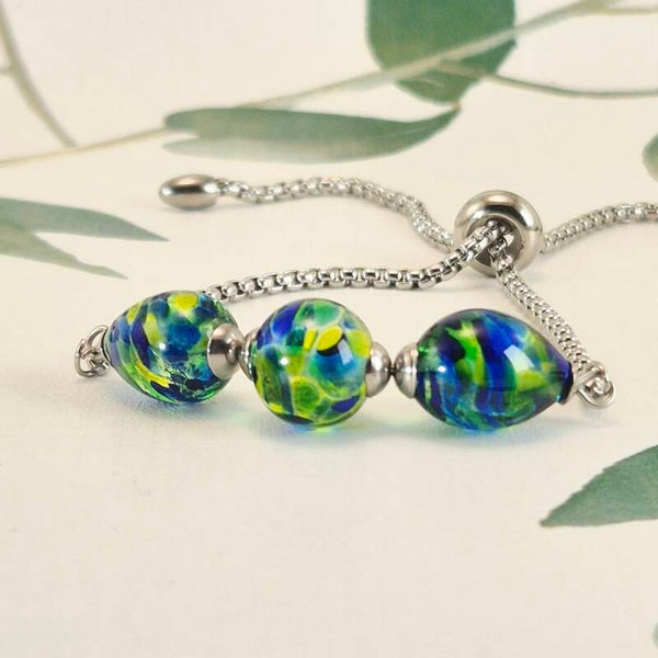 Schuifarmband van edelstaal met 3 glaskralen, transparant groen en blauw - Ocean