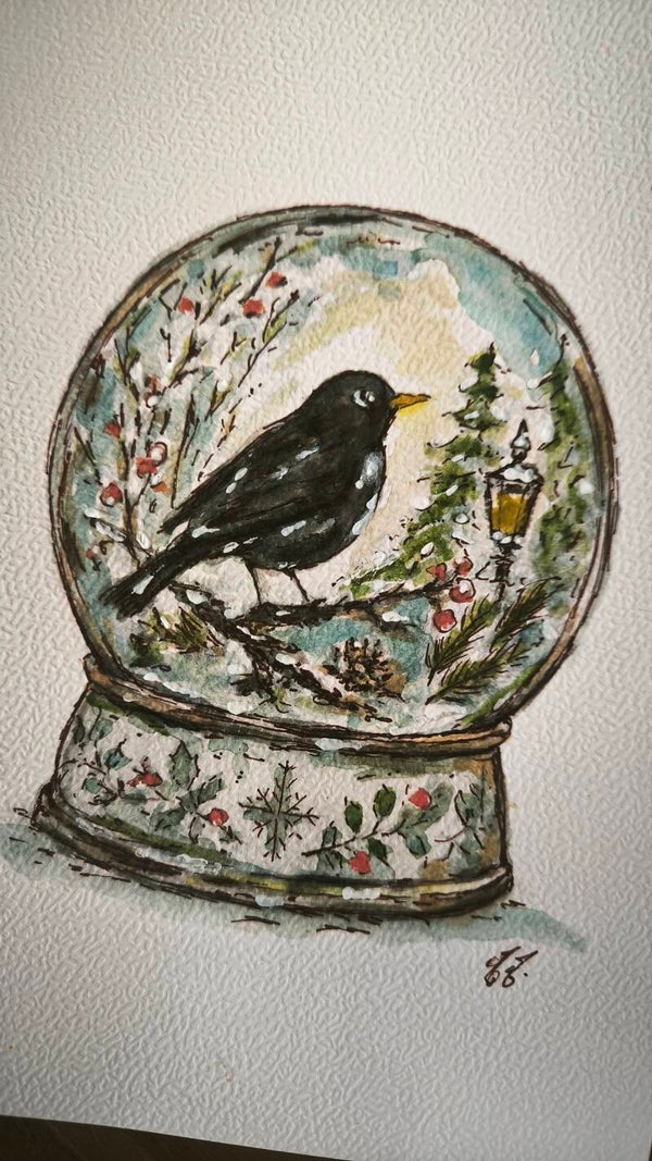 Aquarelle. Boule à neige. Le merle