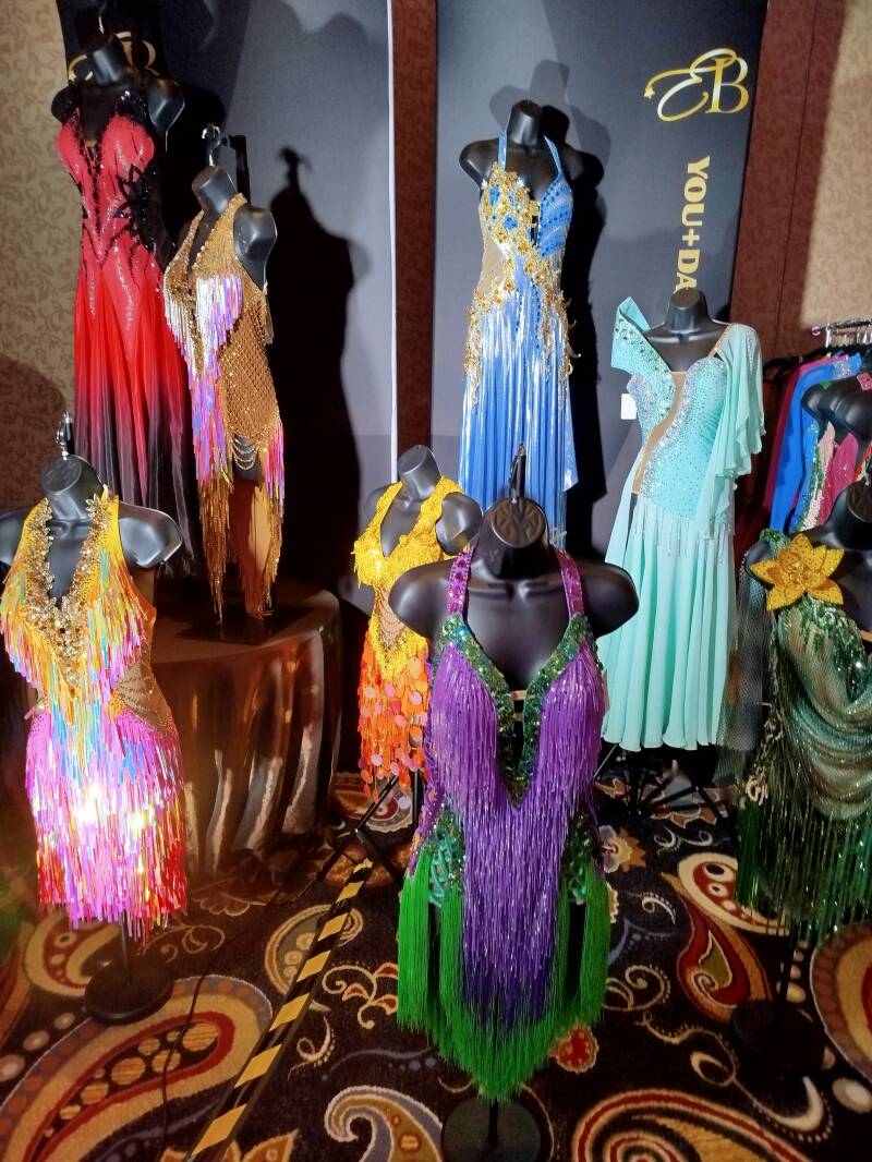 Ballroom dance costumes displayed backstage before a competition in Las Vegas