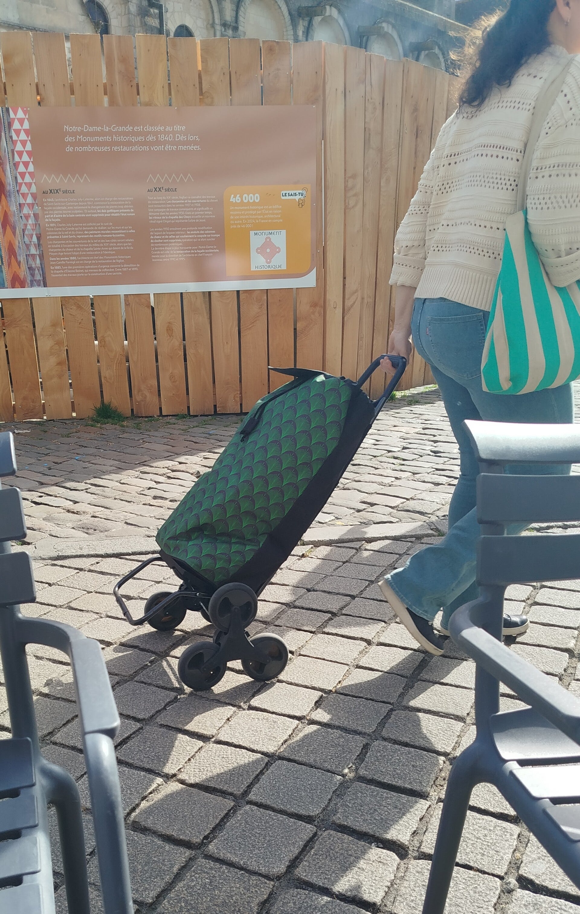 green shopping trolley with three wheels