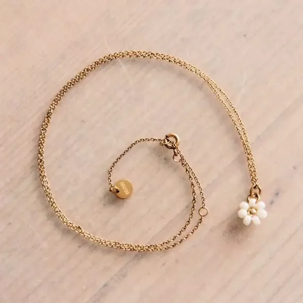 Roestvrij stalen fijne ketting met madeliefjebloem - crème/goud