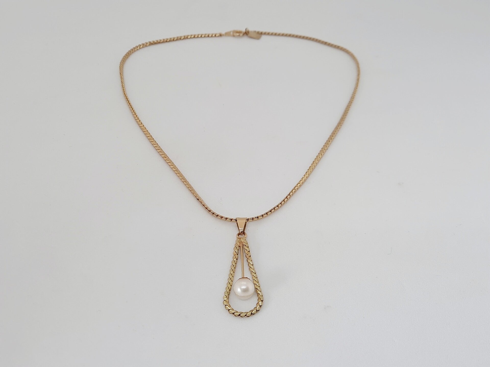 Vintage goudkleurige ketting met parel