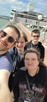 Family photo, 4 people on windy cruiseship deck.. l2cruise, @l2cruise #l2crusie love2cruise, love to cruise