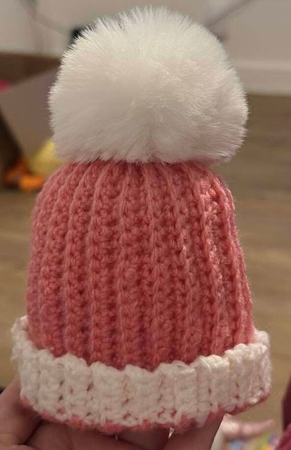 Pink and white bobble hat