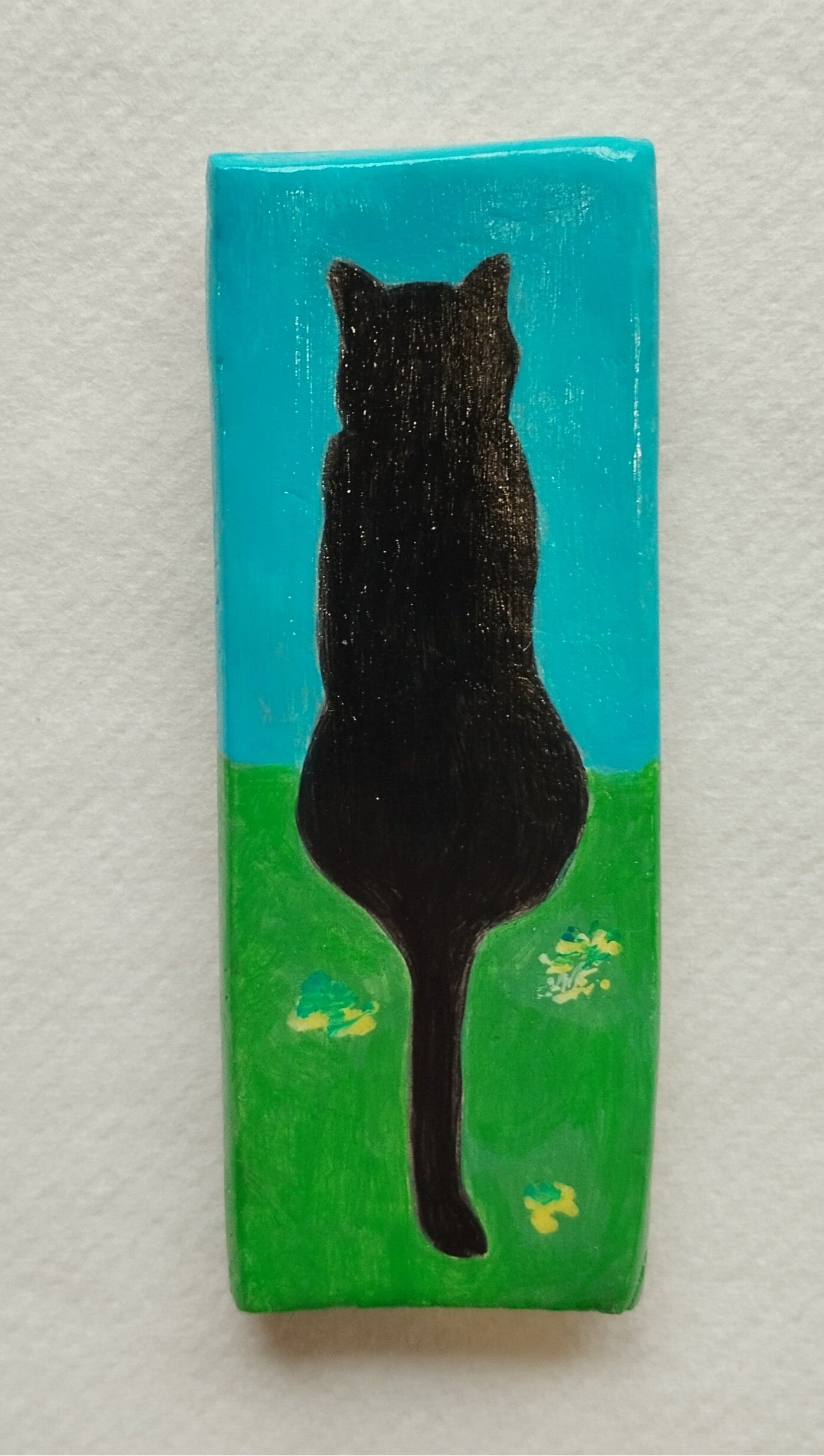Magnet chat noir de dos fond bleu/vert