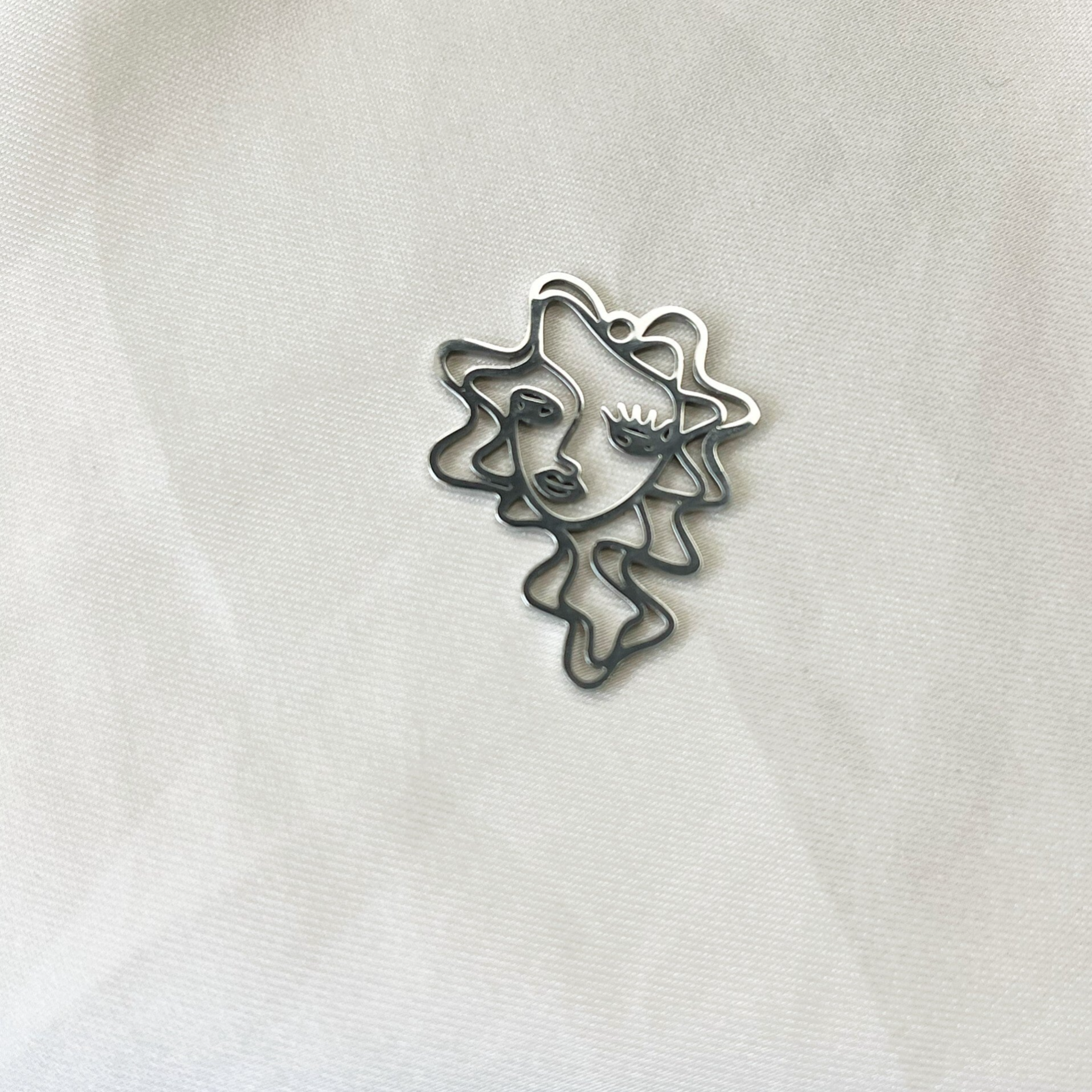 Gezicht bedel zilver