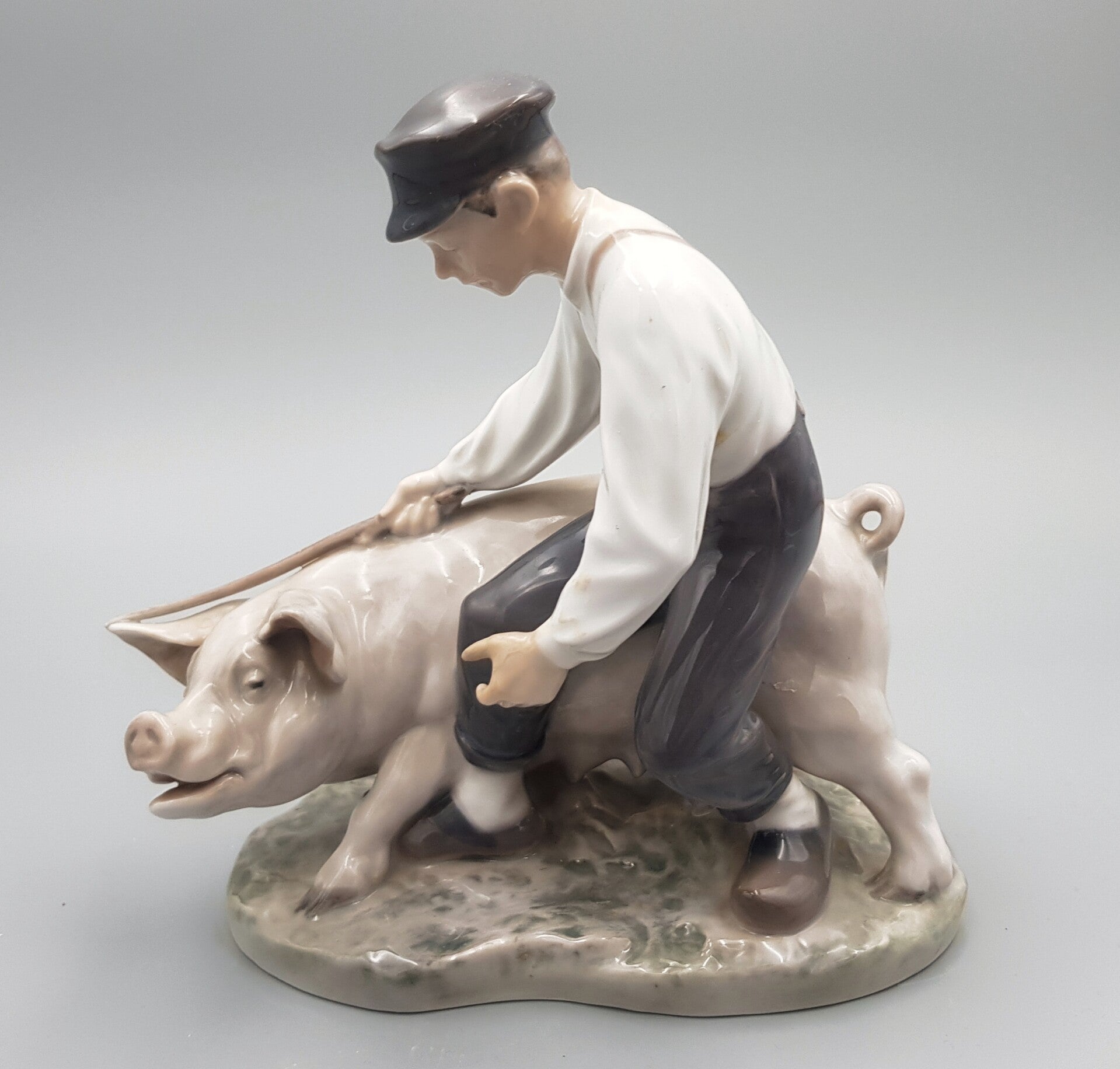 Farm boy with sow - Porclain Figurine - Royal Copenhagen No. 848 - Christian Thomsen