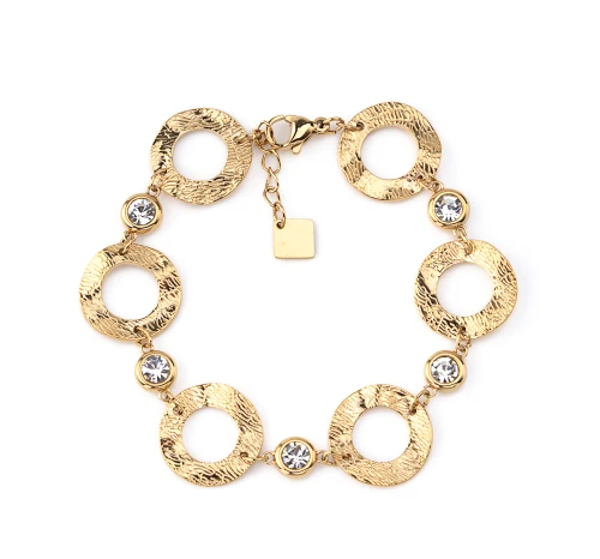 Bracelet en acier inoxydable, anneaux martelés, sertis de pierres scintillantes.