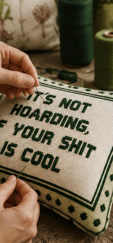 Artisan hand-stitching a luxury custom needlepoint pillow with detailed craftsmanship